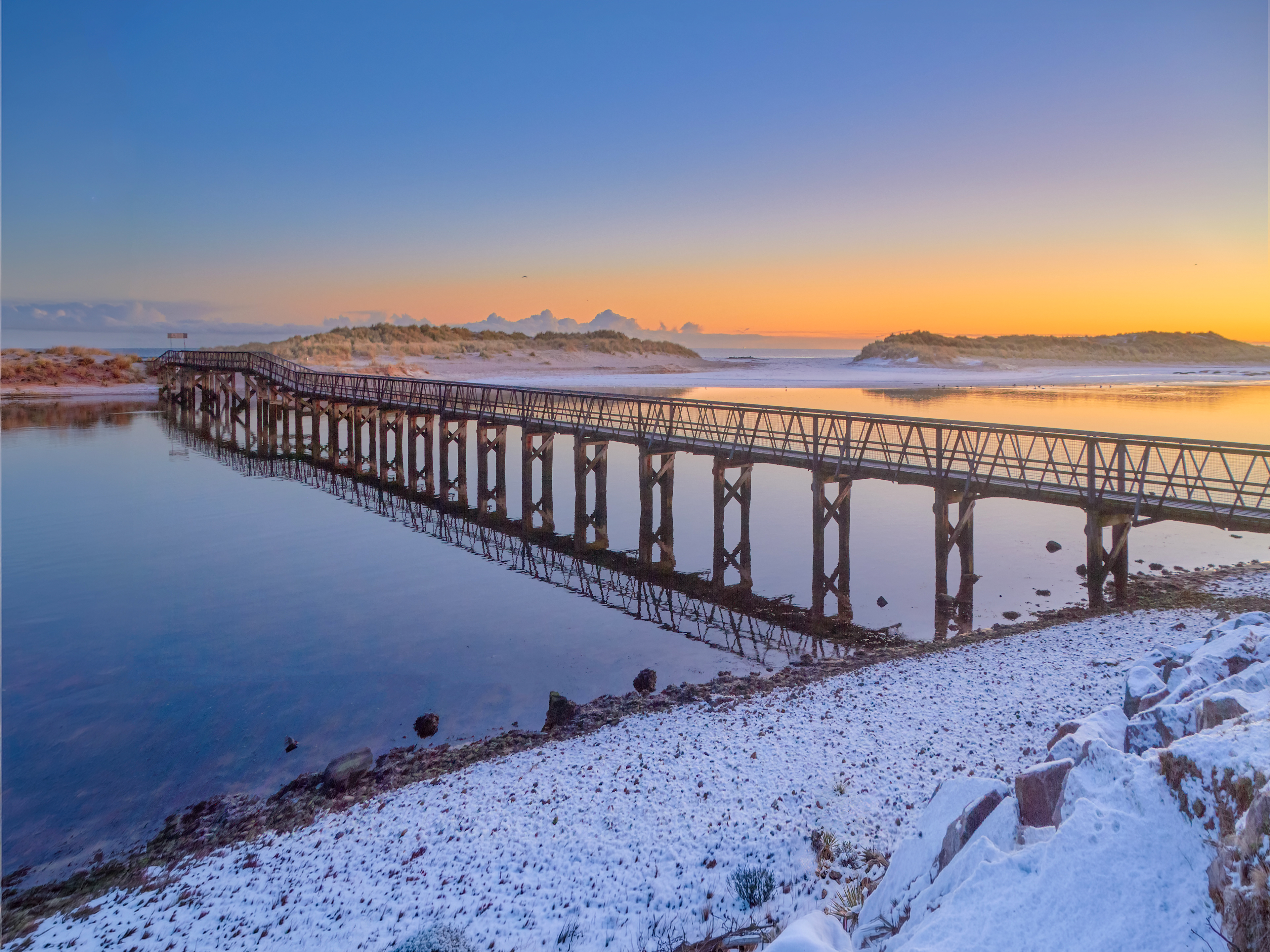 The old Lossiemouth footbridge at sunrise under snow, Moray coast, 2018
